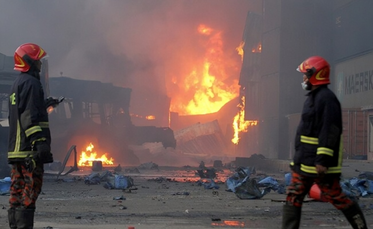 Firefighters Battle Lingering Blazes at Devastated Depot