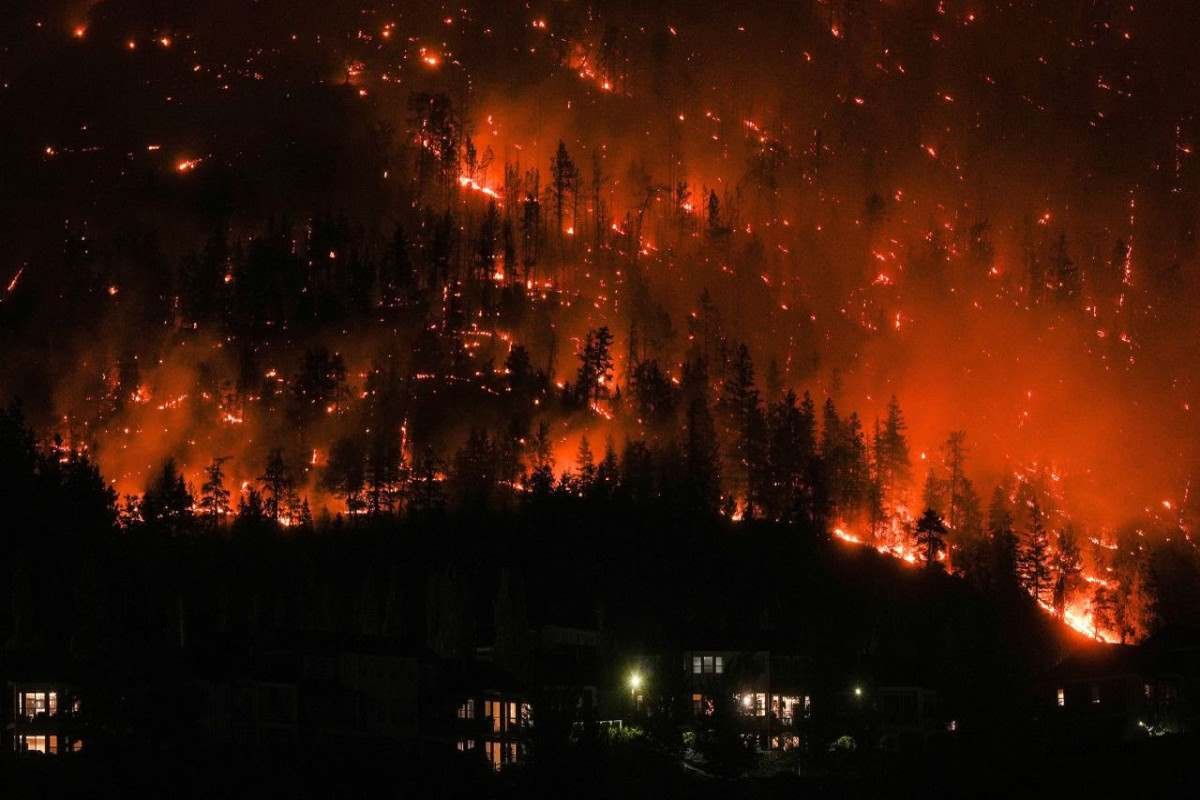 Wildfires threaten western Canada city as far north evacuated